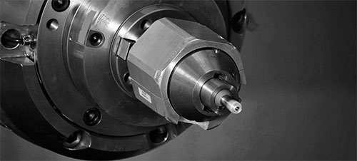 Close up black-n-white image of the tip of a friction stir-welder