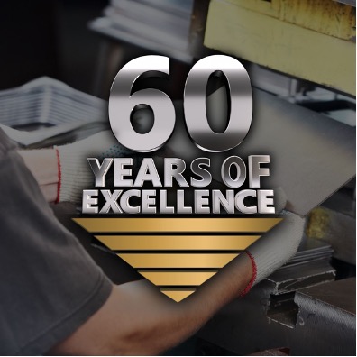 nmc-2025-12-blog-in-text-img2-60-years-of-excellence The 3D text reads “60 YEARS OF EXCELLENCE” with the logo of the parent company, NMLP, centered underneath. The text is overlayed on top of a darkened image of a worker operating a metal sheet press machine.